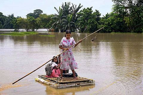 Children move on a makeshift boat